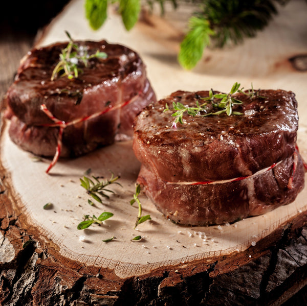 Quick frozen un-aged wild venison saddle (loin) sharing steak